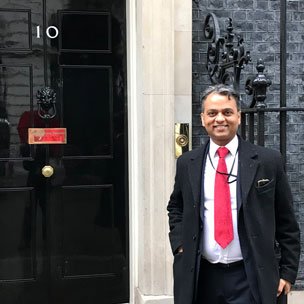 Anand Samani standing in front of 10 Downing Street in London